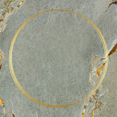 Round golden frame on a marble textured background