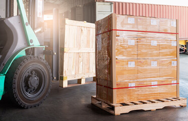 Cargo shipment package boxes. Industry freight truck and warehousing. Forklift loading cargo into...