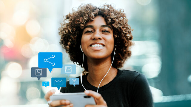 Black lady listening to music from her phone