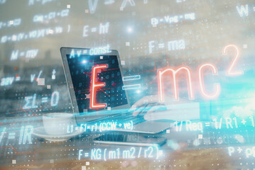 Science formula hologram with man working on computer on background. Education concept. Double...