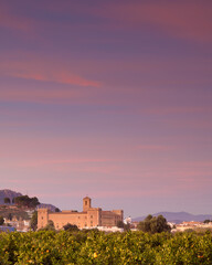Fototapeta premium Vista al atardecer de el Real Monasterio de El Puig de Santamaria, en la provincia de Valencia. Comunidad Valenciana. España