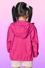 Back view girl wearing pink jacket in studio