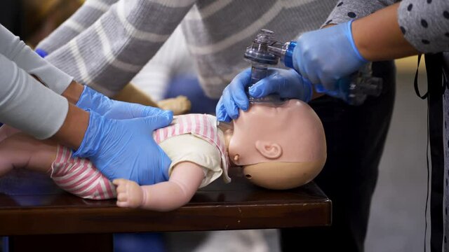 Cardiopulmonary resuscitation on baby. Education healthcare first aid of cardiopulmonary resuscitation on baby