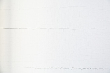 Fototapeta premium White cracked paint. Abstract background of white peeling paint