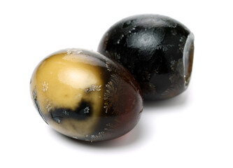 preserved duck eggs on white background
