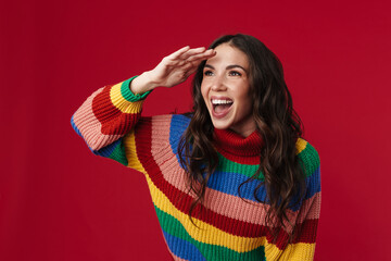 Joyful beautiful brunette girl smiling and looking at camera