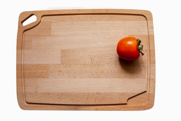 Fresh organic  ripe fruit red persimmon on wooden cutting board  background. Top view. Flat lay.  