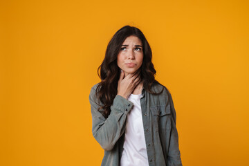 Unhappy beautiful girl sore throat posing at camera