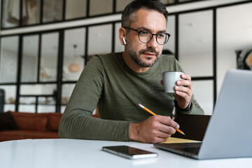 Handsome confident young businessman working