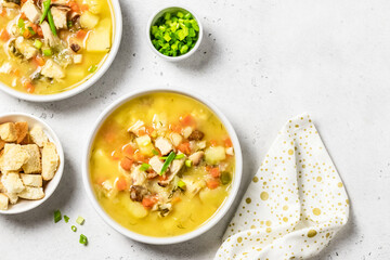 Yellow split pea soup puree with bacon. Space for text, top view.