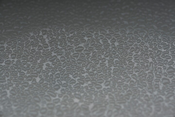 rough grainy textured background with shades of gray as a liquid on a metal surface in black and...