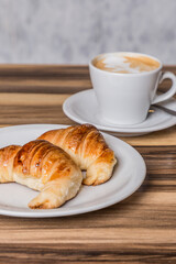 coffee with milk breakfast with croissants on wood