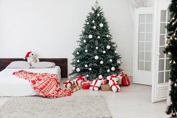 Christmas tree with gift decor bedroom with bed new year feast winter background