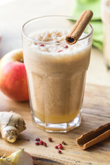 Traditional hot toddy winter drink with recipe. Healthy organic homemade holiday celebration beverage. Hot apple smoothie  on wood table. 