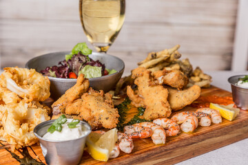 spectacular mix of sea fish with salad and white wine