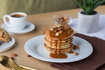 Stack of pancakes with caramel syrup