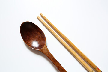 wooden spoon and chop stick on white background