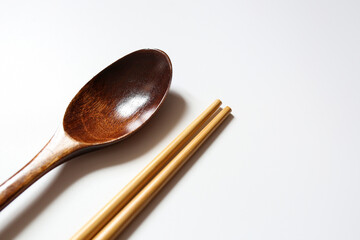 wooden spoon and chop stick on white background