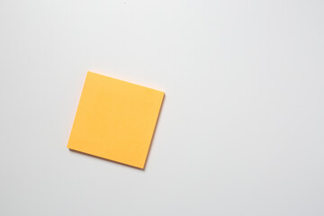 yellow sticky note on white