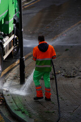 Cleaning the street with water