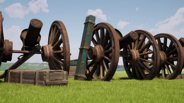 Old and disused Gatling Guns and wooden ammunition boxes rotting away on the battlefield where they once fired.
