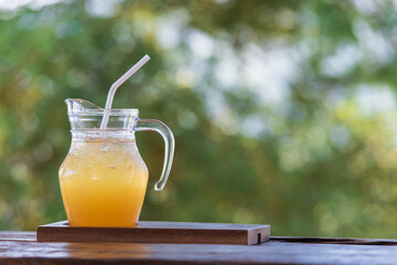 Ice honey lemon soda mixed in glass jug
