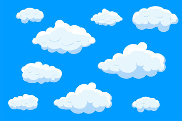 Obraz premium White cartoon clouds set isolated on blue background. Collection of different cartoon clouds for background template, wallpaper and sky design. Cartoon clouds vector. Sky illustration