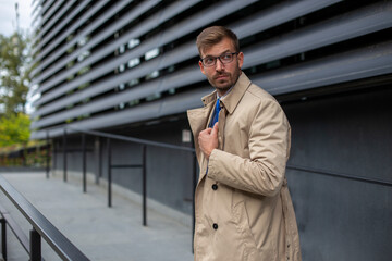 Portrait of a businessman in front of the modern building.