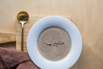 Mushroom cream soup in a white  plate. Cream of champignon soup 