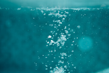 Air bubbles in water in swimming pool