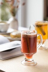 Sangria pomegranate, pear, orange, kumquat and spices, cinnamon, cloves, star anise.