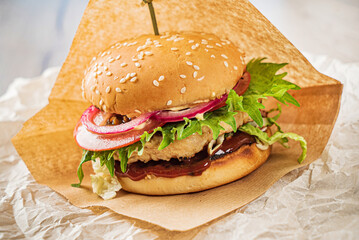 burger with meat cutlet and vegetables