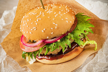 burger with meat cutlet and vegetables