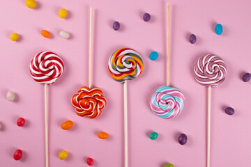 colourful lollipops on the pink background