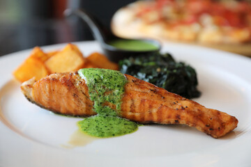 Salmon steak with pesto sauce