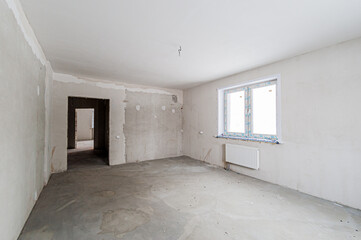 Fototapeta premium Russia, Moscow- April 17, 2020: interior room apartment rough repair for self-finishing. interior decoration, bare walls of the premises, stage of construction