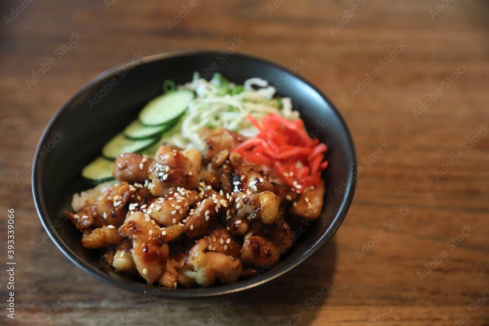 Wall mural japanese food Chicken teriyaki with rice on wood background