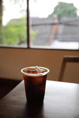 ice coffe on wood table in local coffee shop