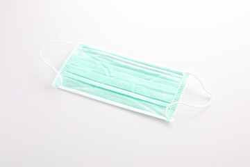 Used green mask isolated in white background