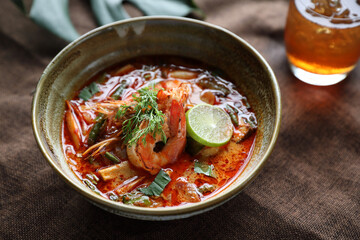 Tom Yum soup , a Thai traditional spicy prawn soup