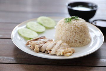 Thai food gourmet steamed chicken with rice khao mun kai in wood background
