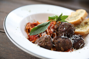 Spaghetti Meatballs on wood background