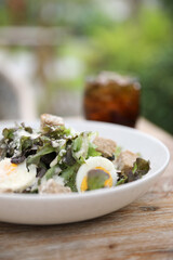 caesar salad appetizer on wooden background