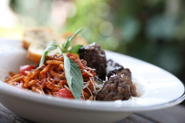 Spaghetti Meatballs on wood background