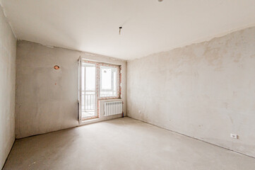 Russia, Moscow- April 17, 2020: interior room apartment rough repair for self-finishing. interior decoration, bare walls of the premises, stage of construction