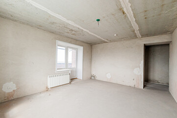 Russia, Moscow- April 17, 2020: interior room apartment rough repair for self-finishing. interior decoration, bare walls of the premises, stage of construction
