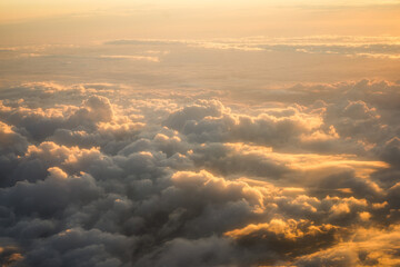 the golden light above the clouds at sunset