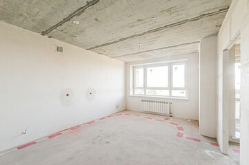 Russia, Moscow- April 17, 2020: interior room apartment rough repair for self-finishing. interior decoration, bare walls of the premises, stage of construction