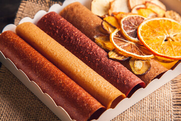 Sweet fruit snacks in a package - pastilles and dried fruit.