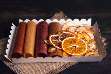 Sweet fruit snacks in a package - pastilles and dried fruit.